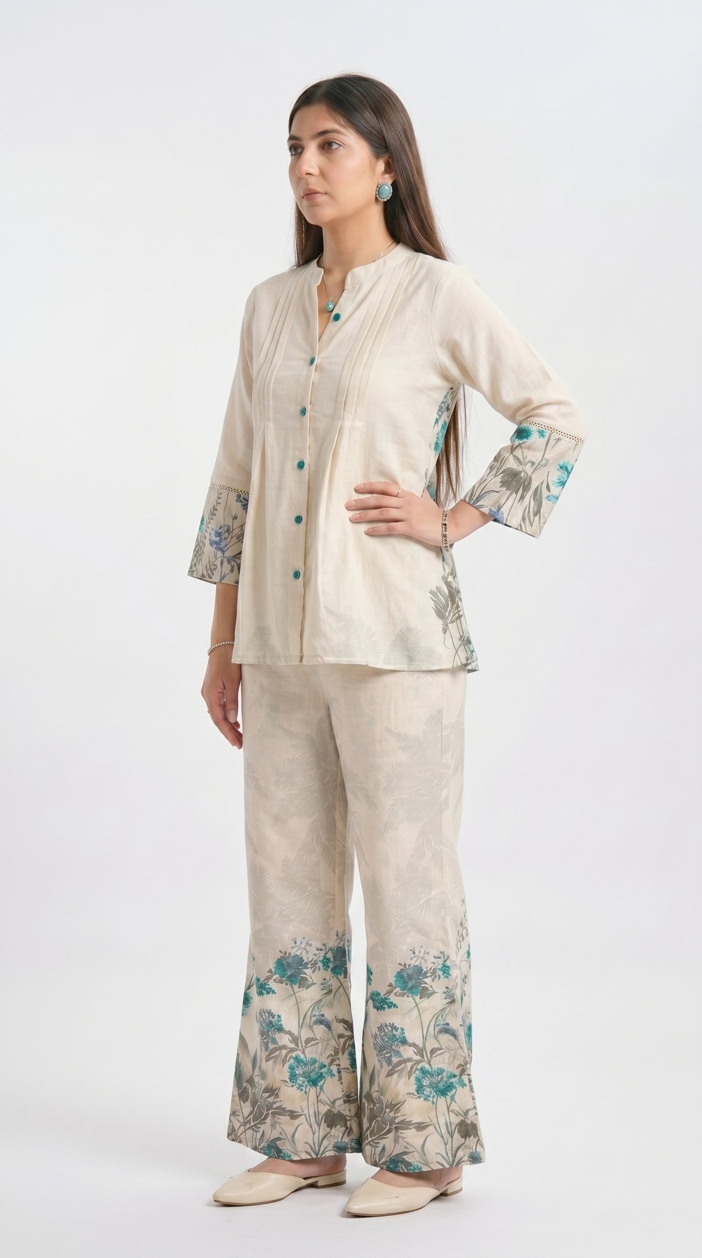 Woman wearing a beige floral outfit on a white background