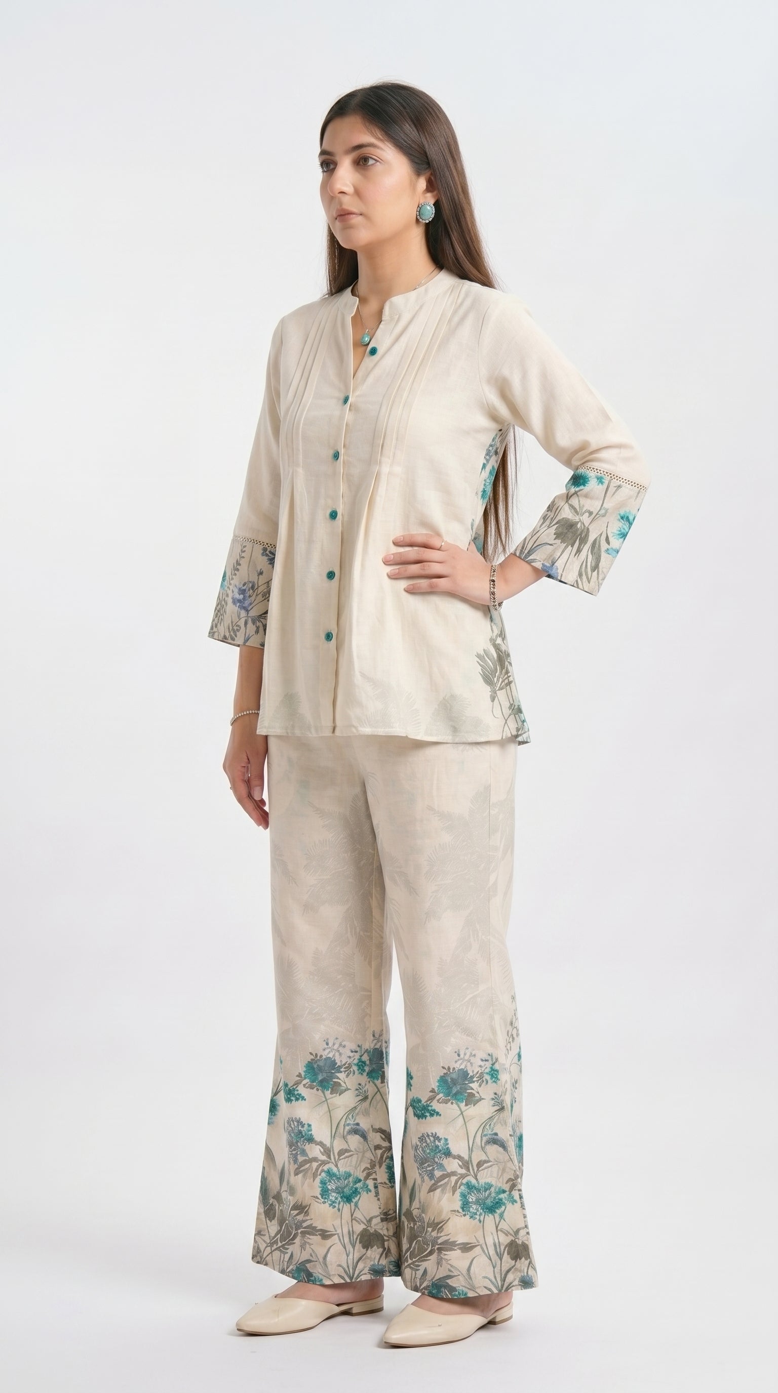 Woman wearing a beige floral outfit on a white background