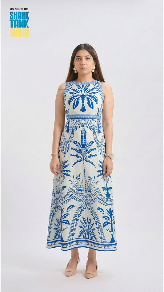 Woman wearing a blue and white patterned dress on a white background