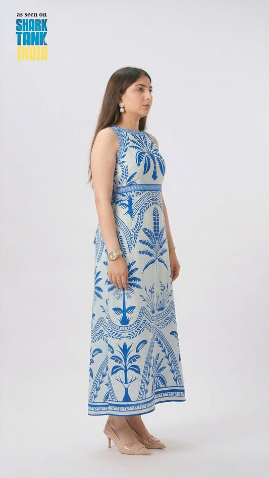 Woman wearing a blue and white patterned dress on a white background with 'Shark Tank' branding.