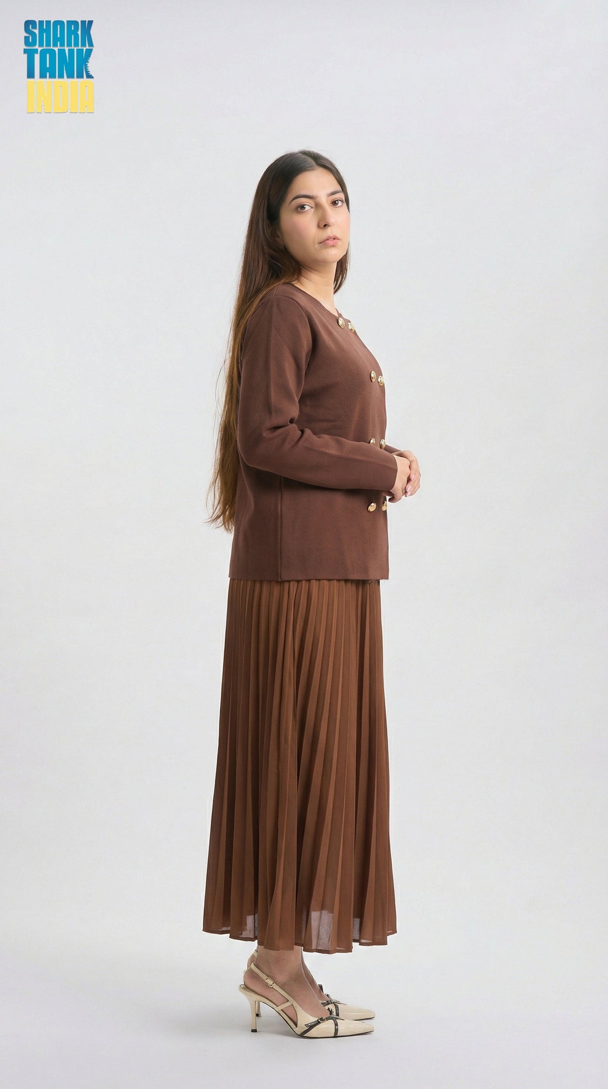 Woman wearing a brown outfit on a white background