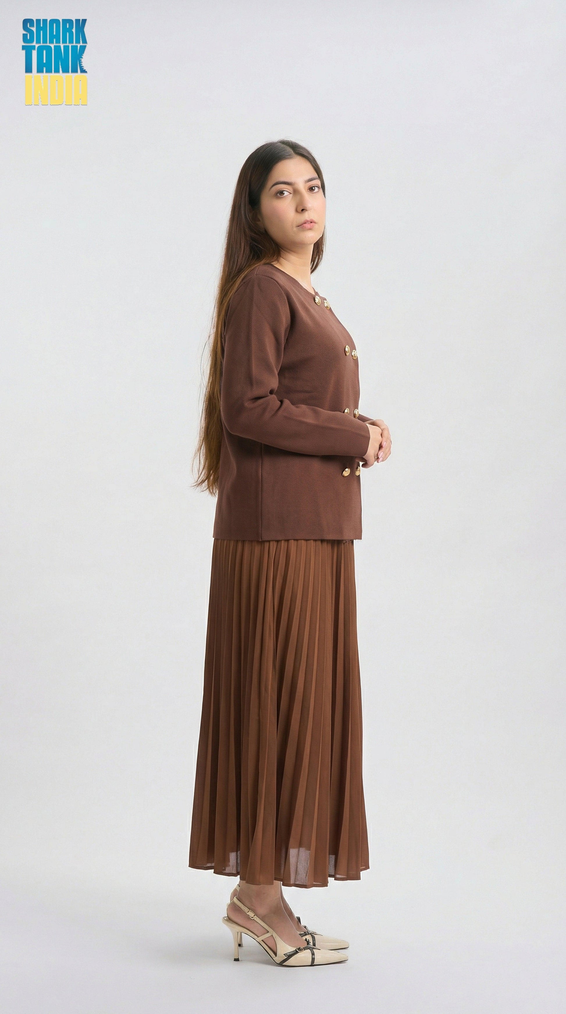 Woman wearing a brown outfit on a white background