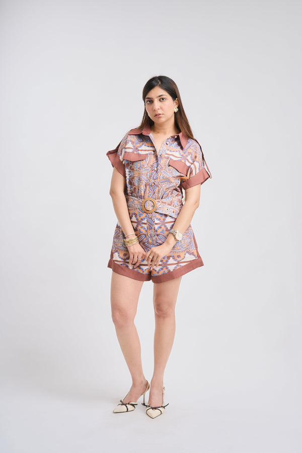 Woman wearing a patterned dress on a white background