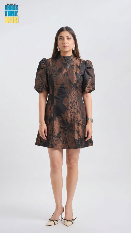 Woman wearing a patterned dress on a white background