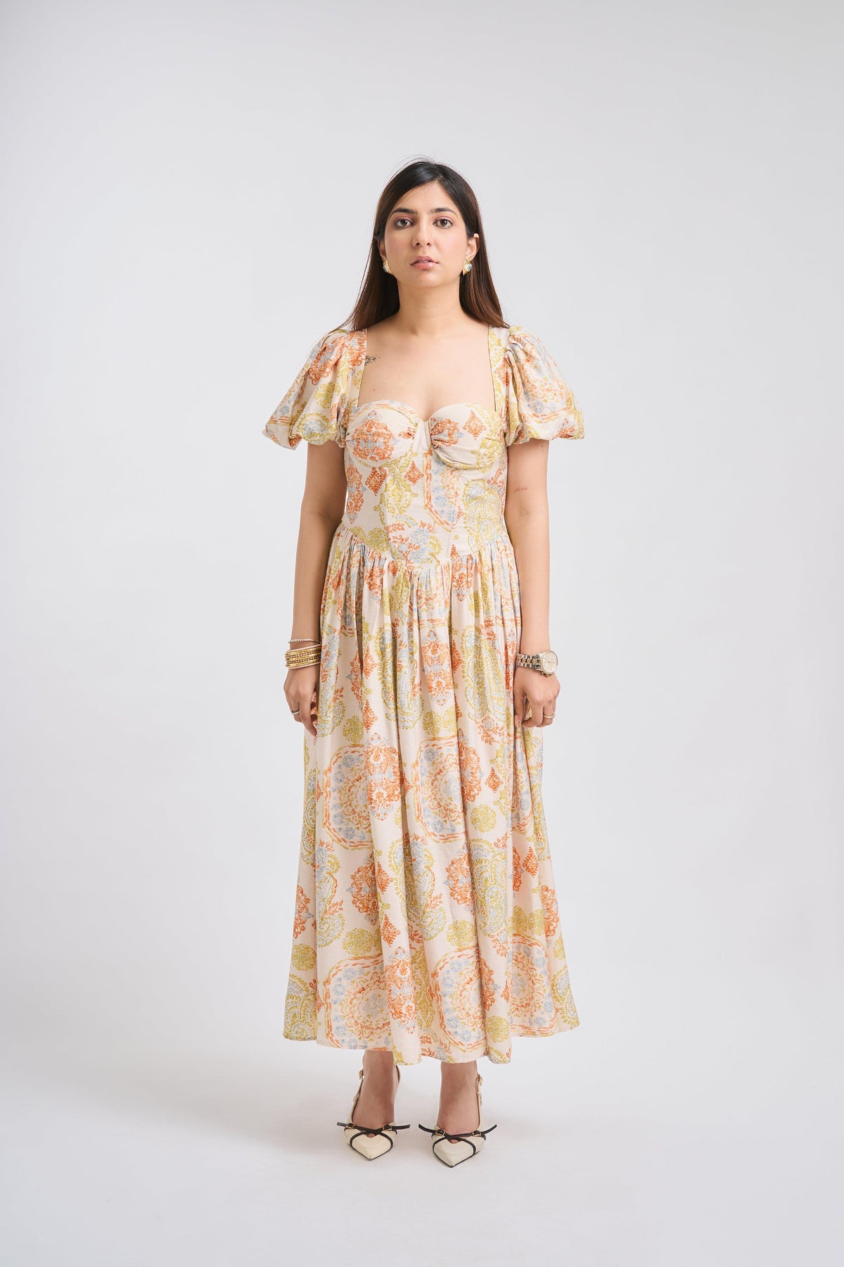 Woman wearing a floral dress on a white background