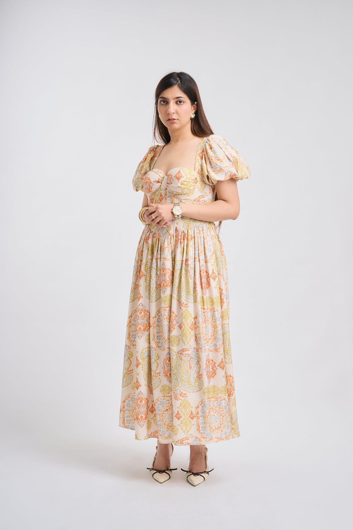 Woman wearing a floral dress on a white background