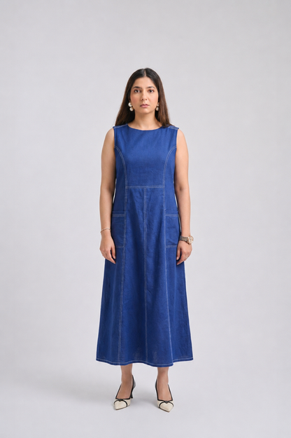 Woman wearing a blue dress on a light gray background