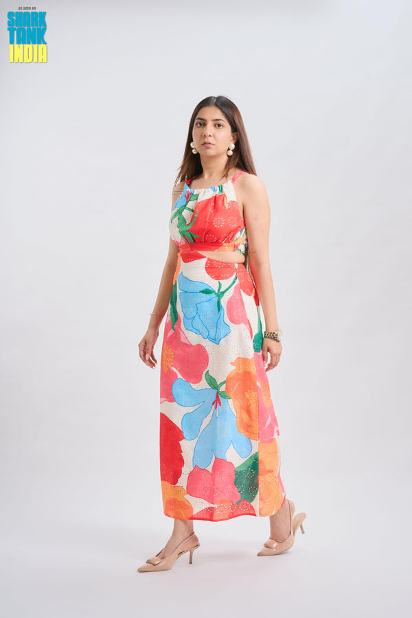 Woman wearing a colorful floral dress on a white background