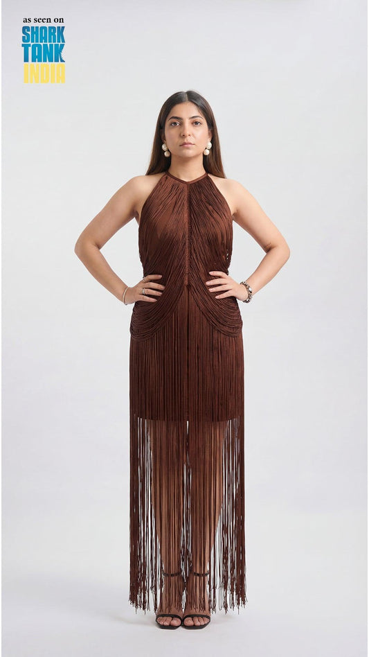 Woman wearing a brown fringe dress on a white background