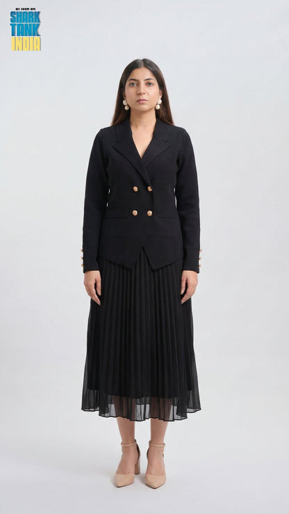 Woman wearing a black blazer and pleated skirt on a white background
