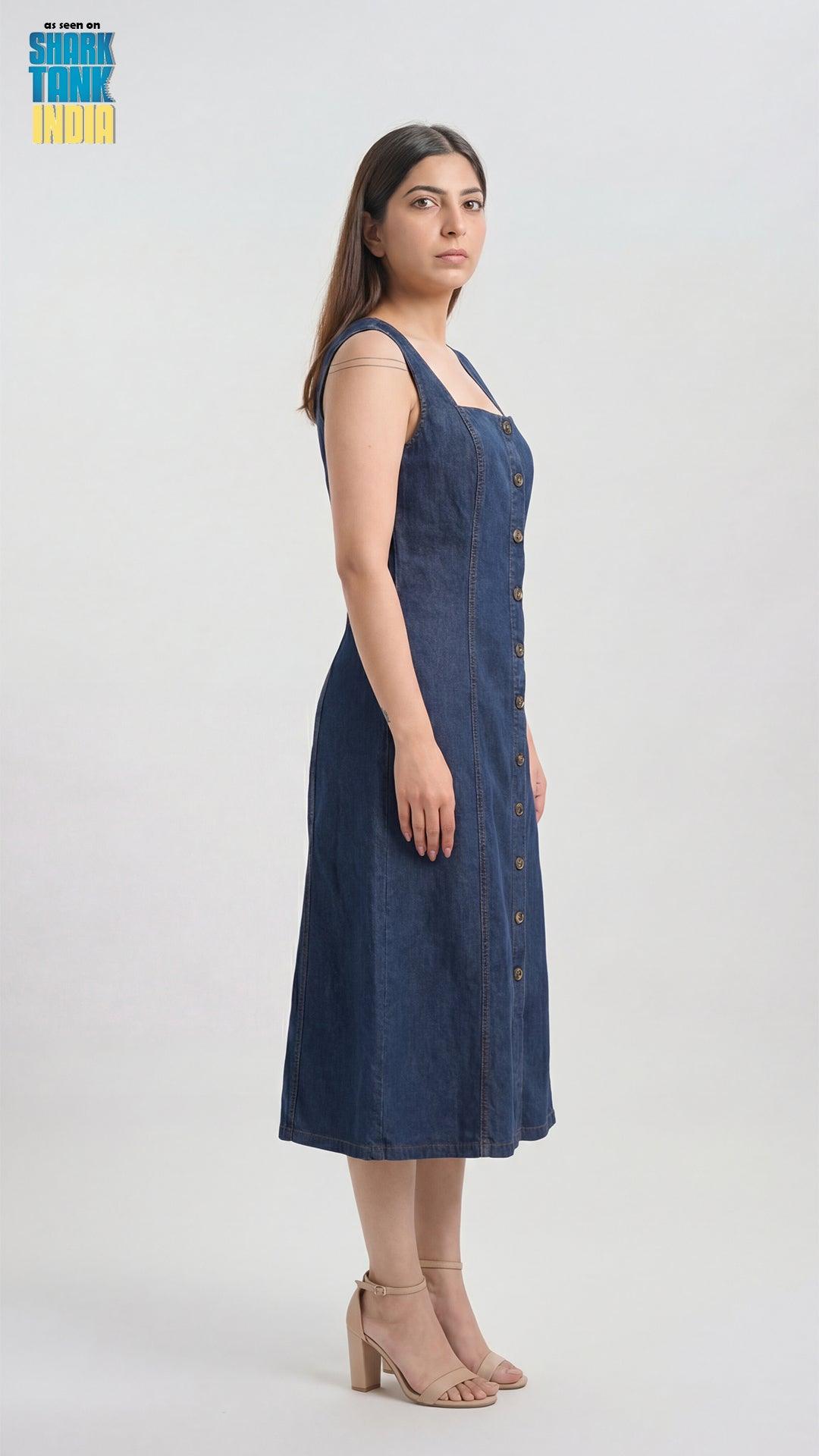 Woman wearing a blue dress against a white background
