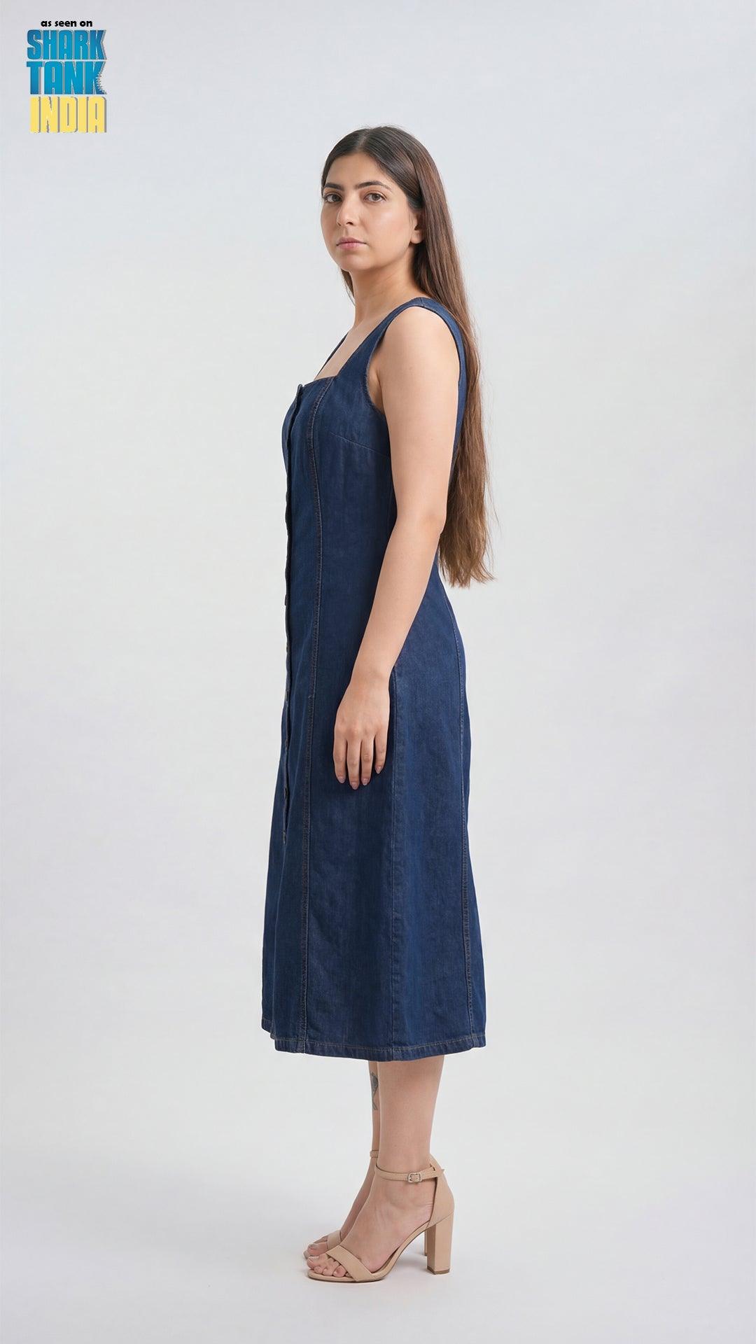Woman wearing a blue dress against a white background