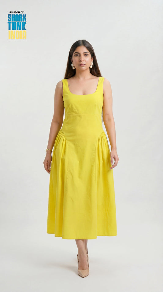 Woman wearing a yellow dress on a white background