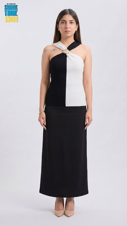 Woman wearing a black and white dress on a white background