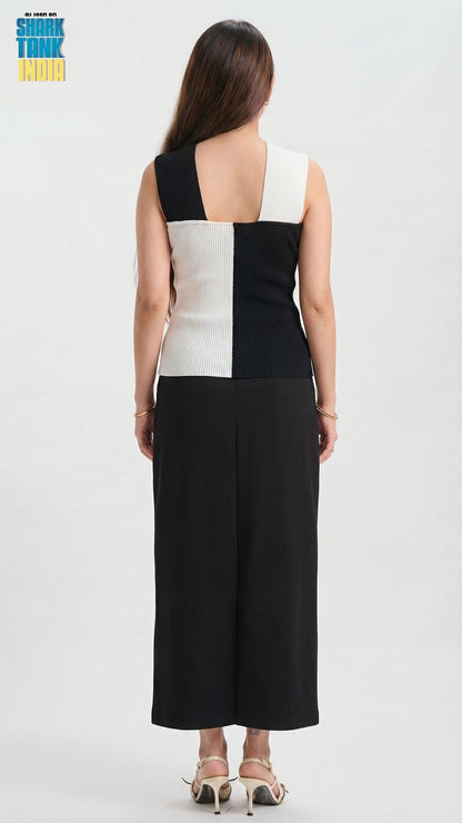 Woman wearing a black and white checkered dress on a white background
