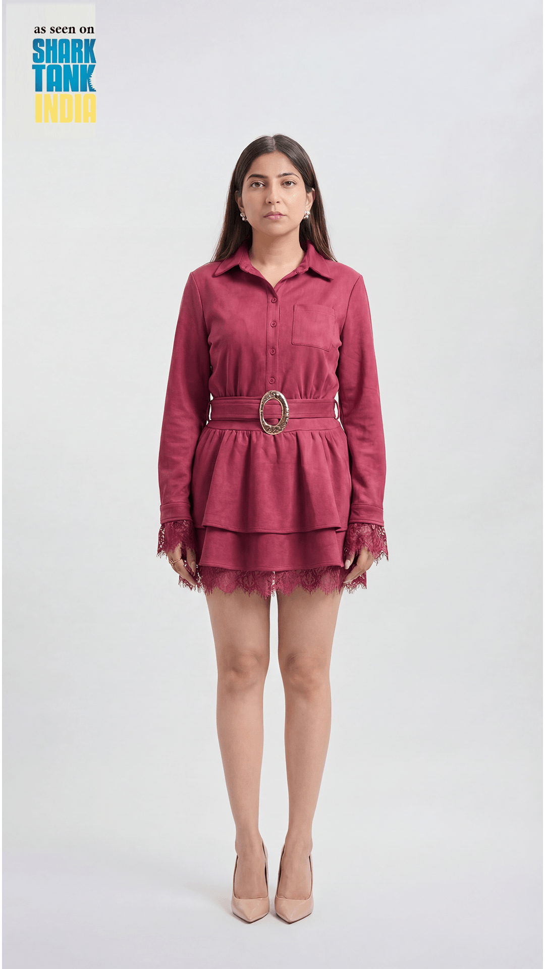 Woman wearing a red dress with a belt on a white background