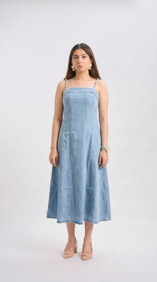 Woman wearing a light blue dress on a white background