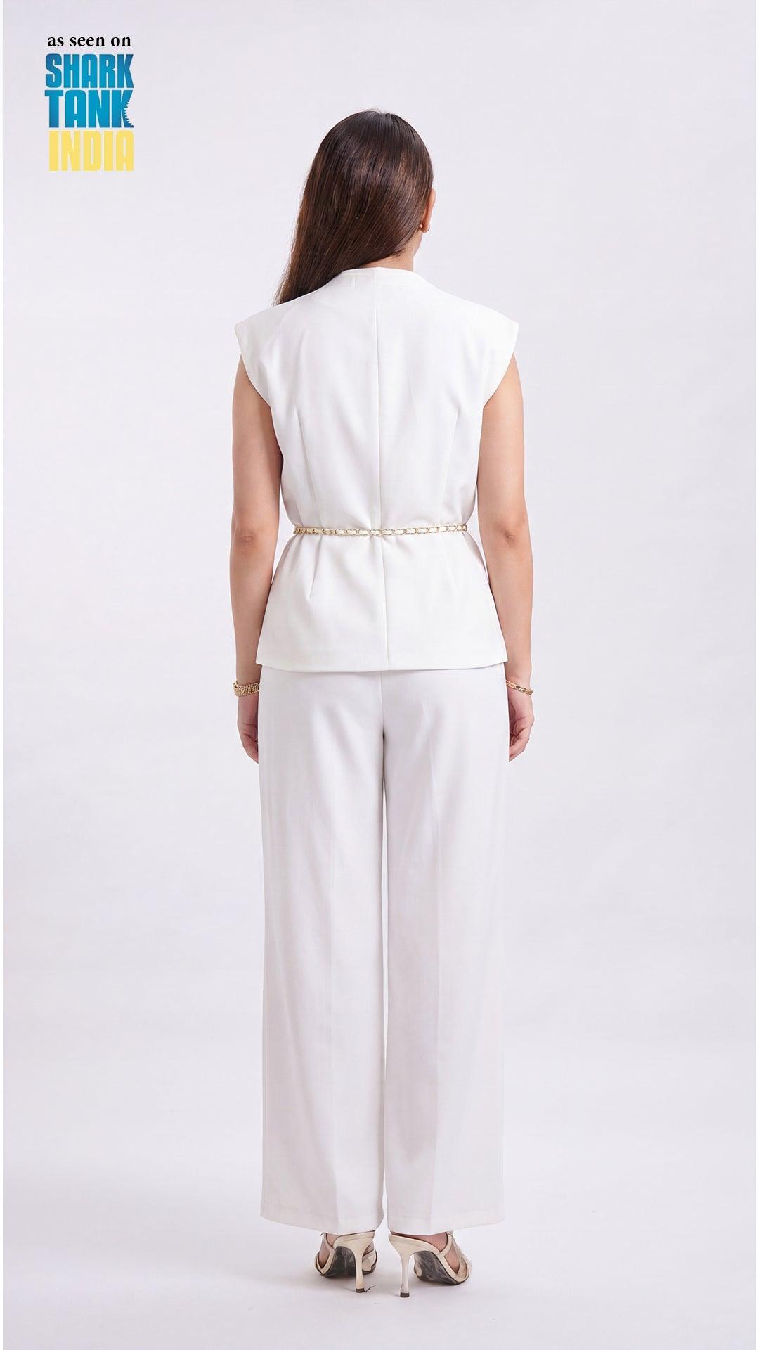 Woman wearing a white outfit on a plain background with 'Shark Tank' branding.