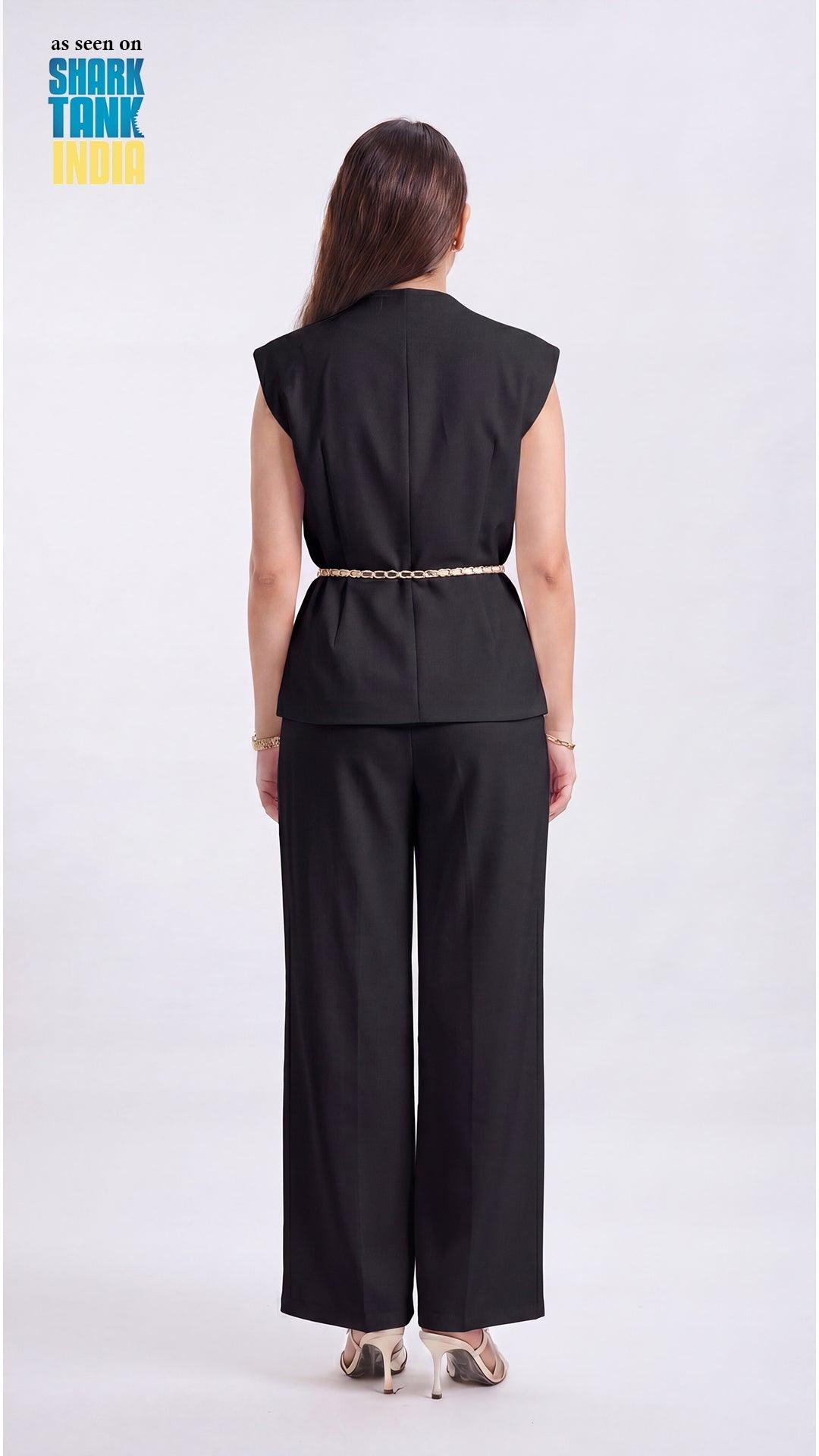 Person wearing a black sleeveless top and wide-leg pants on a white background with 'Shark Tank' branding.