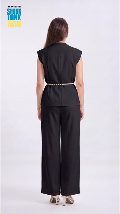Person wearing a black sleeveless top and wide-leg pants on a white background with 'Shark Tank' branding.