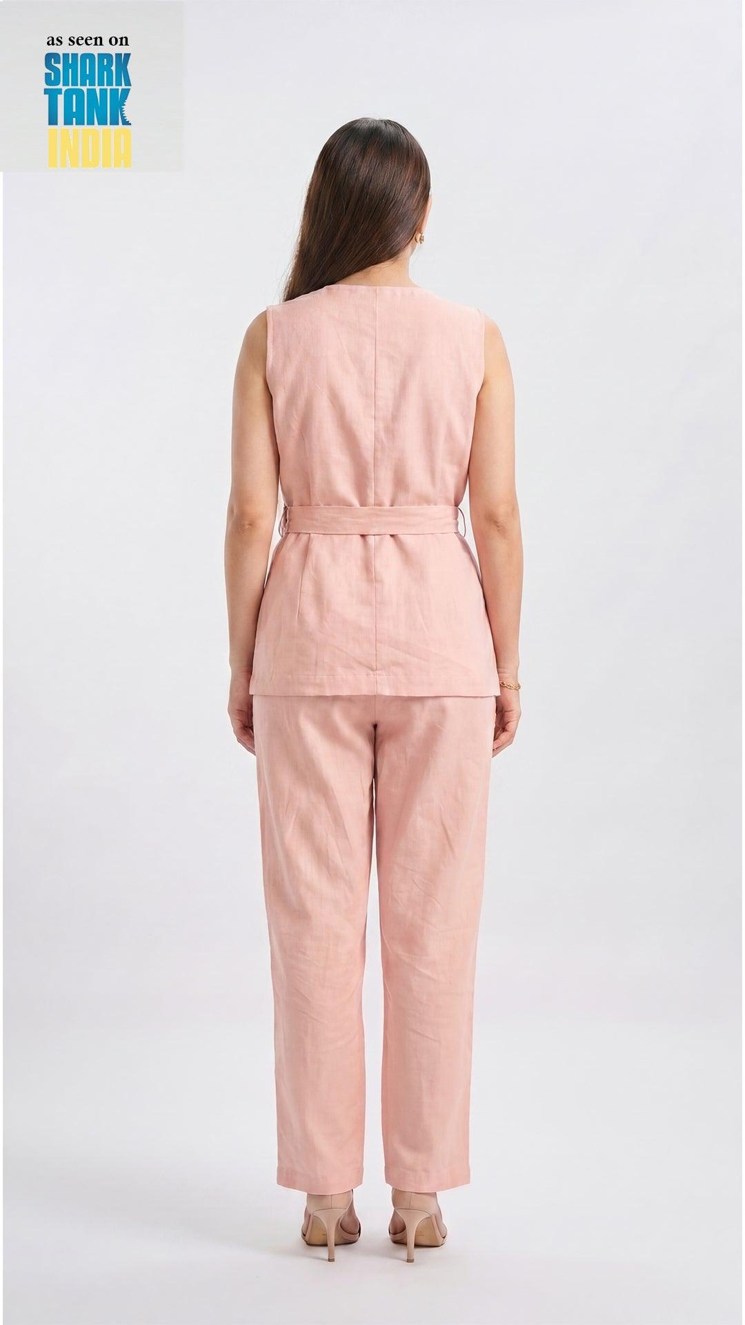 Woman wearing a pink sleeveless top and pants set on a white background with 'Shark Tank' logo.