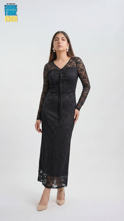 Woman wearing a black lace dress on a white background