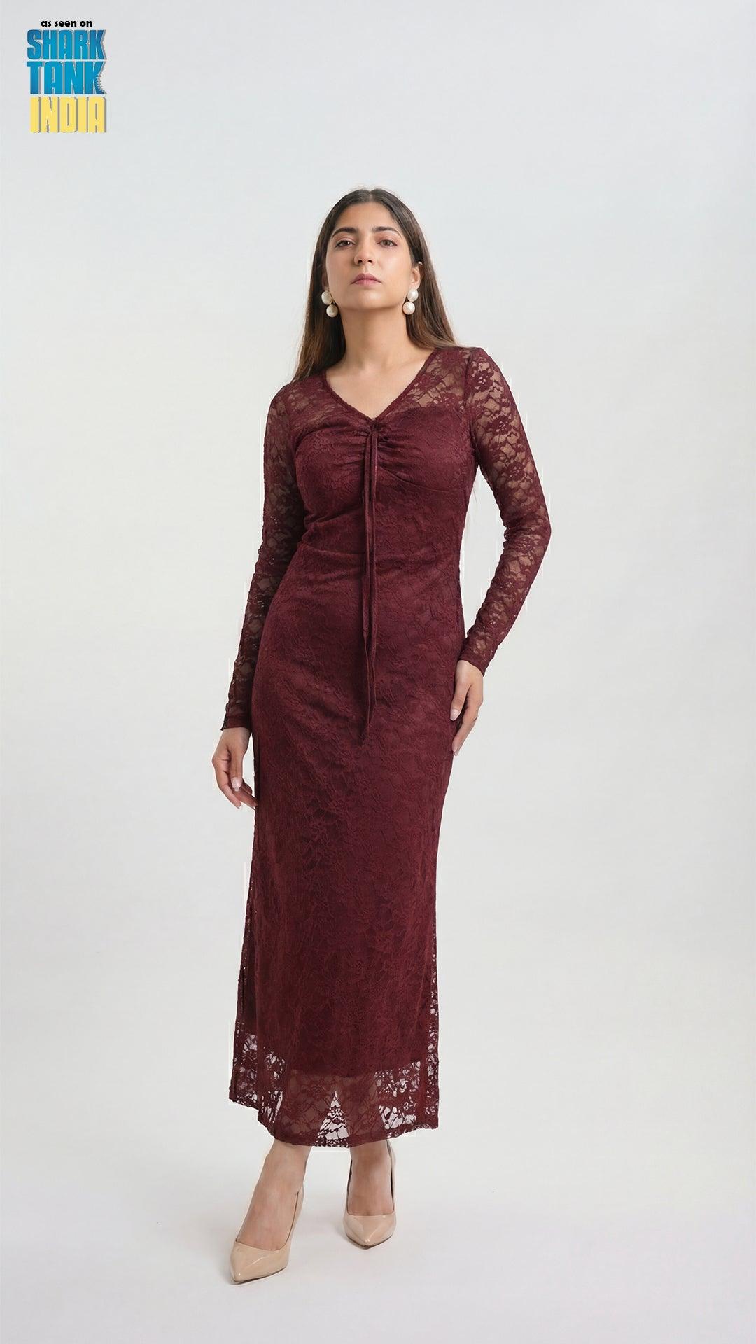 Woman wearing a burgundy lace dress on a white background