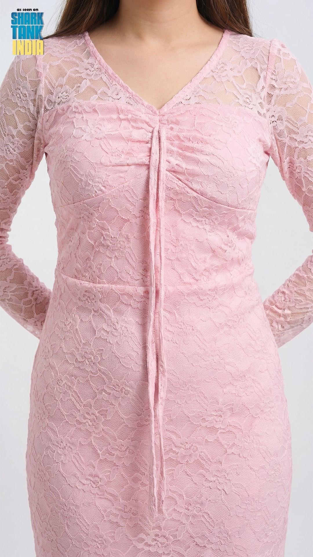Close-up of a pink lace dress on a white background