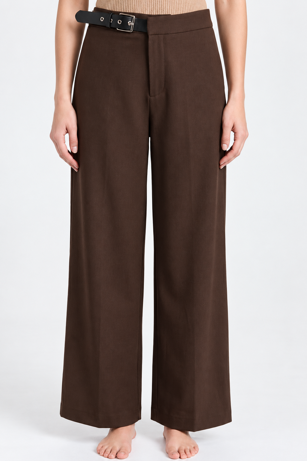 A model wearing dark brown wide-leg trousers with a black belt, shown from the waist down against a plain white studio background.