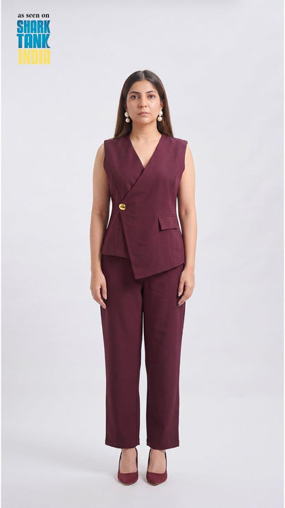 Woman wearing a burgundy suit with a vest and pants on a white background, featuring Shark Tank branding.