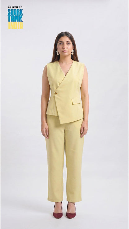Woman wearing a light yellow suit on a white background