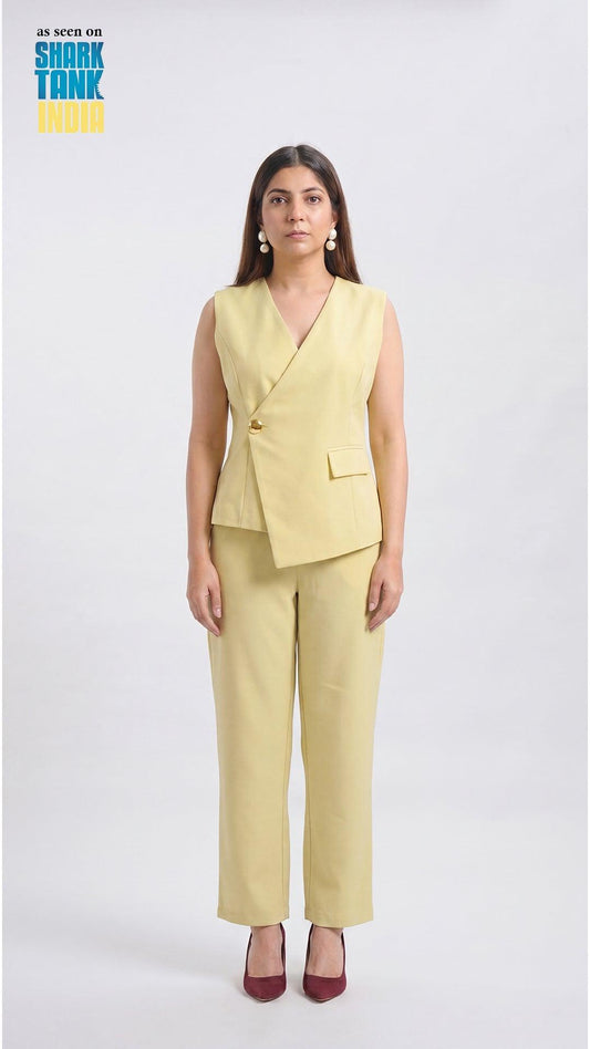 Woman wearing a light yellow suit on a white background