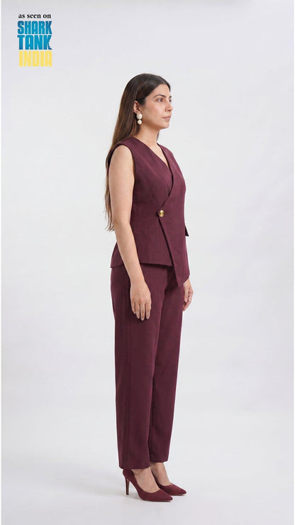 Woman wearing a burgundy suit on a white background with 'Shark Tank' branding.