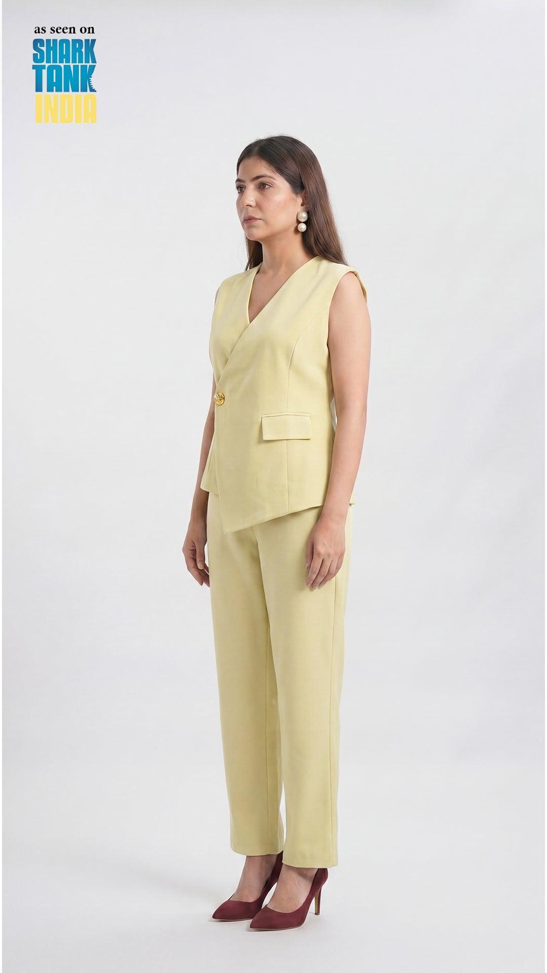 Woman wearing a light yellow pantsuit on a white background with 'Shark Tank' branding.