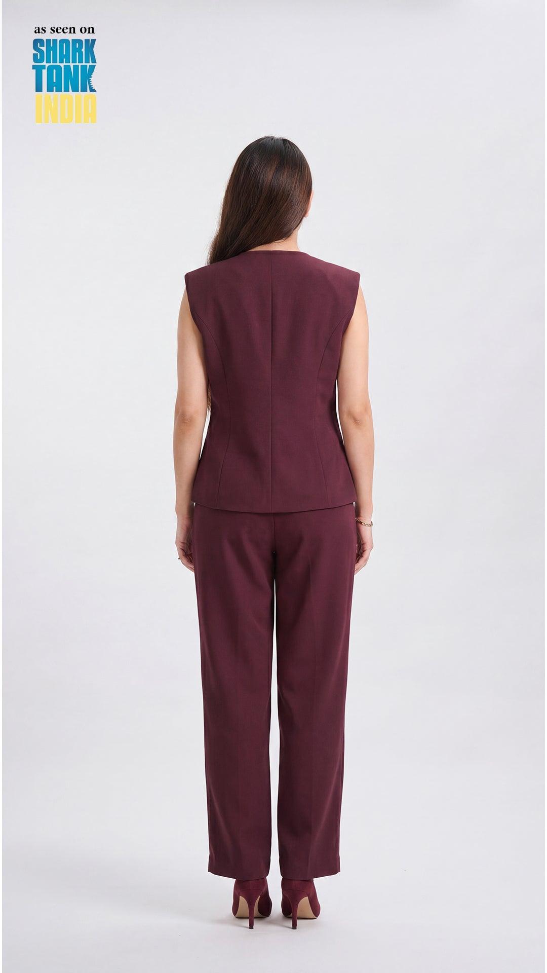 Woman wearing a burgundy sleeveless top and pants on a white background with 'Shark Tank' branding.