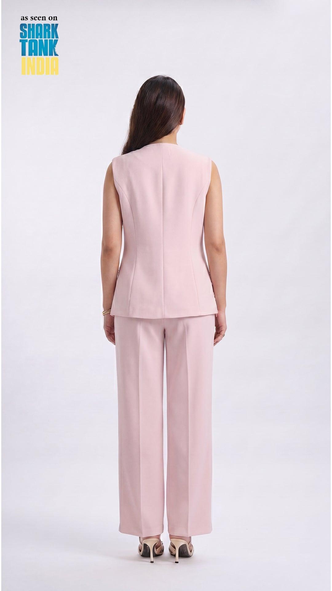 Woman wearing a pink suit on a white background with 'Shark Tank' branding.