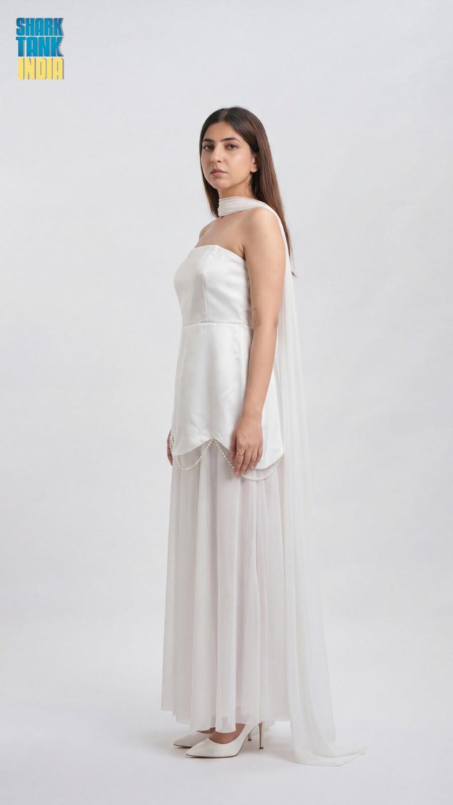 Woman wearing a white strapless dress on a white background