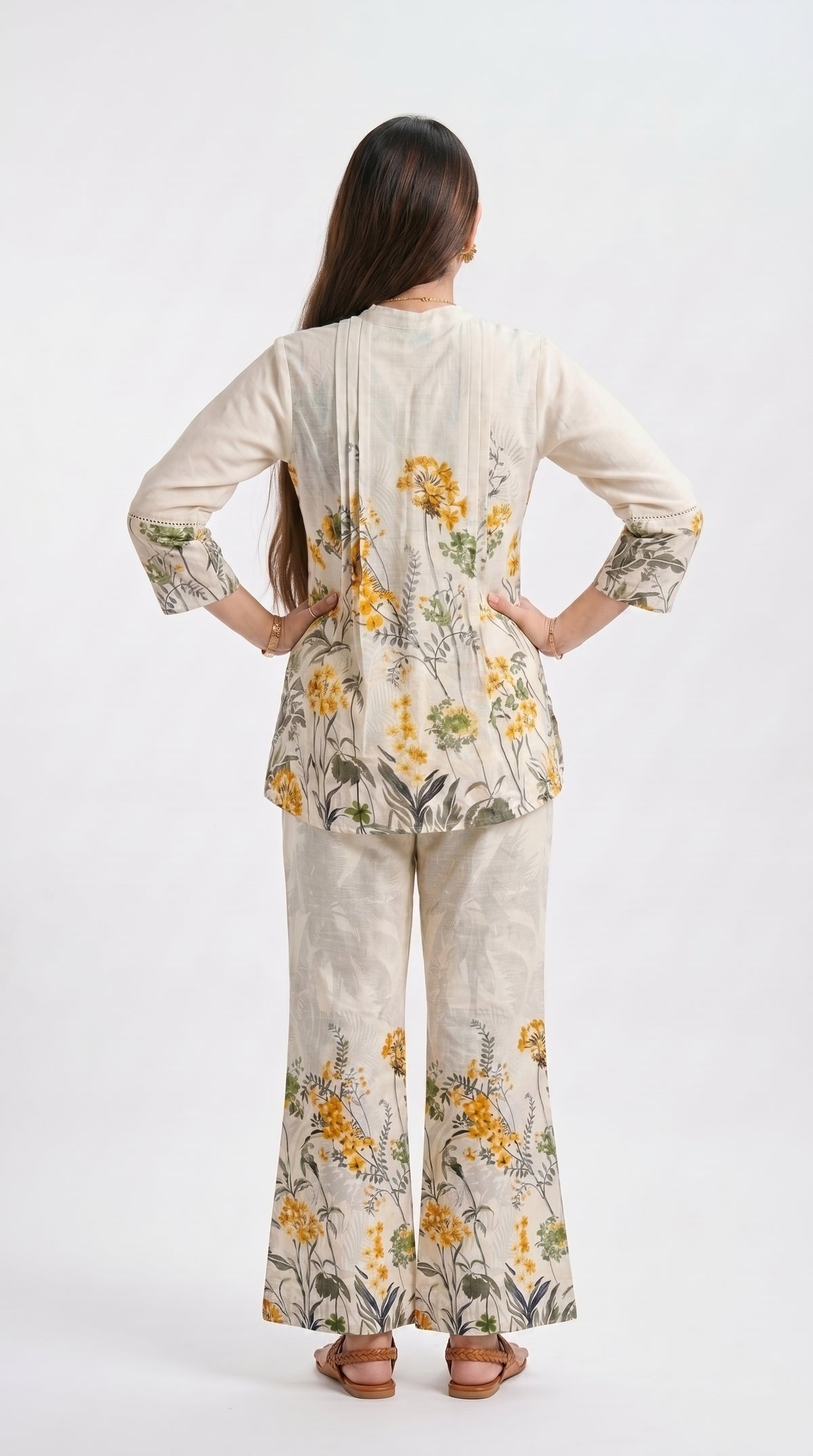 Woman wearing a floral outfit on a white background