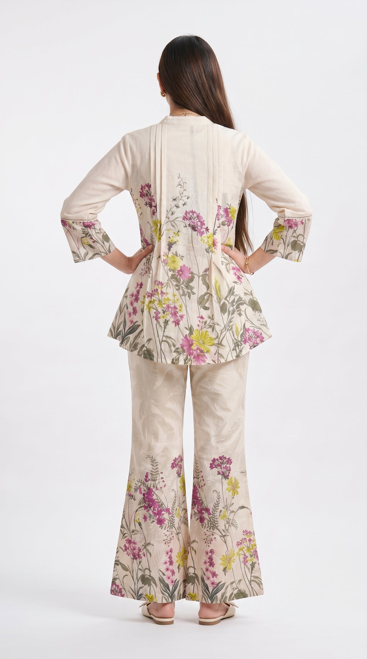 Woman wearing a floral outfit on a white background