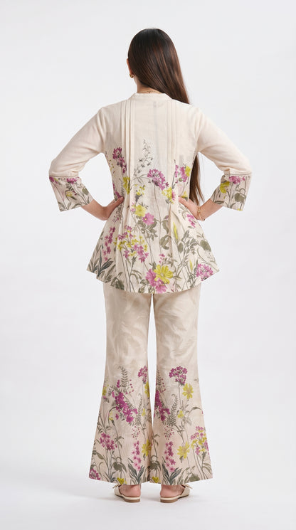 Woman wearing a floral outfit on a white background