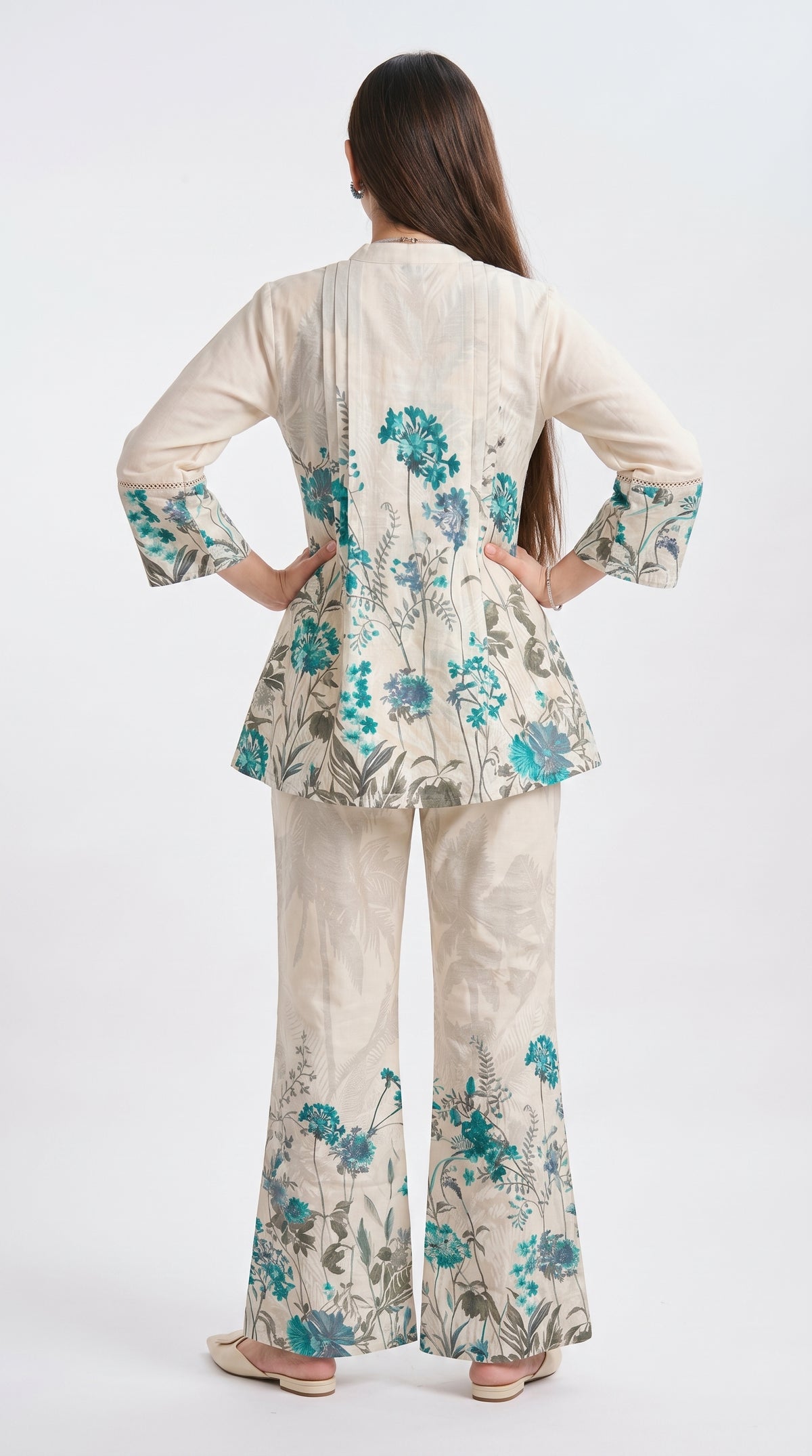 Woman wearing a floral outfit with a white background