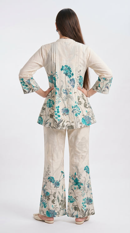 Woman wearing a floral outfit with a white background