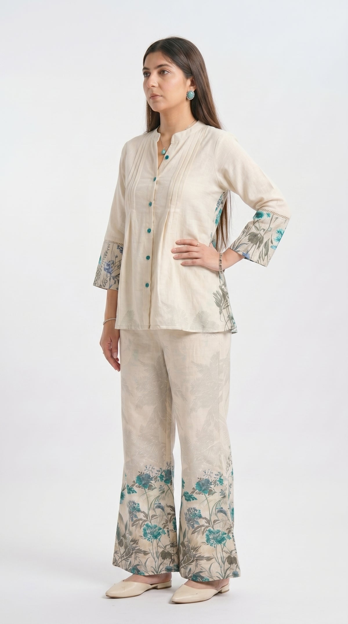 Woman wearing a beige floral outfit on a white background