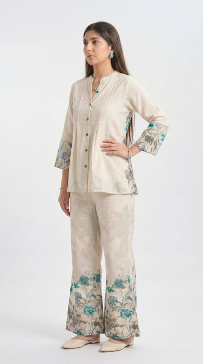 Woman wearing a beige floral outfit on a white background