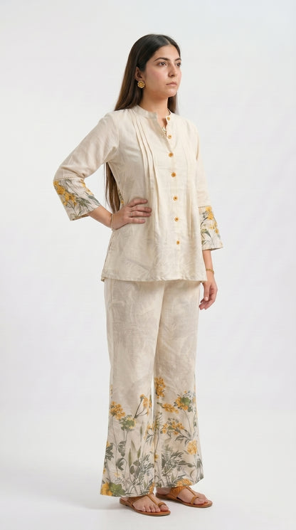 Woman wearing a beige outfit with floral patterns on a white background