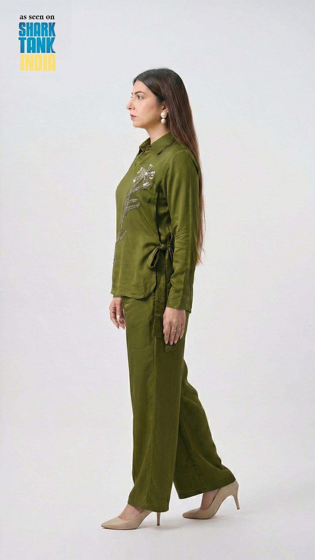 Woman wearing a green outfit on a white background with 'Shark Tank' branding.