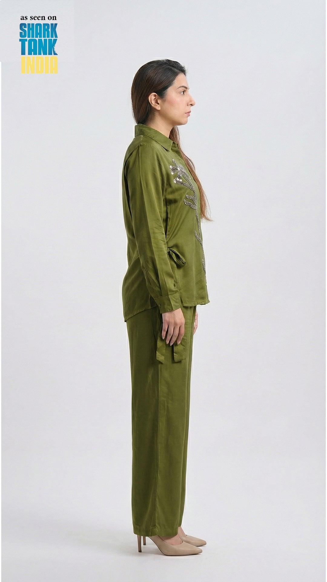 Woman wearing a green outfit on a white background with 'Shark Tank' branding.