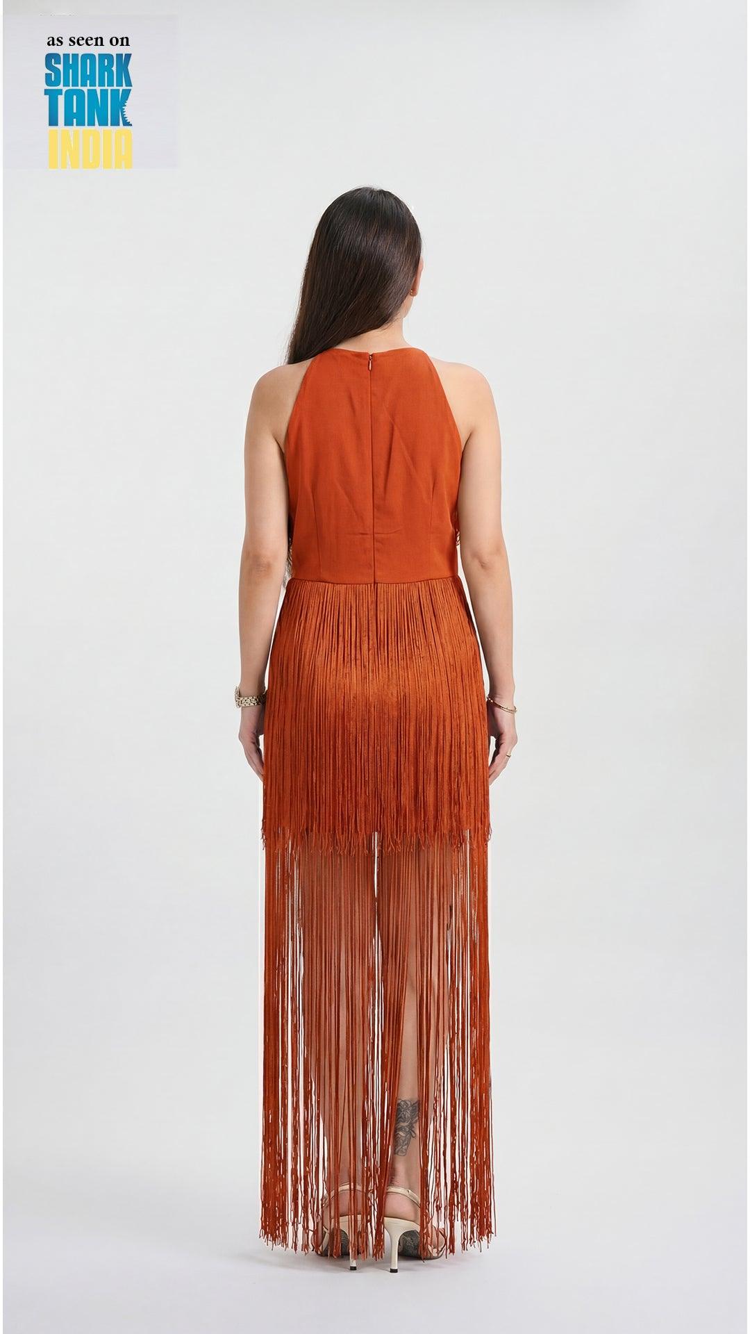 Woman wearing a rust-colored fringe dress on a white background with 'Shark Tank' branding.