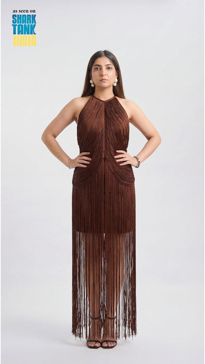 Woman wearing a brown fringe dress on a white background
