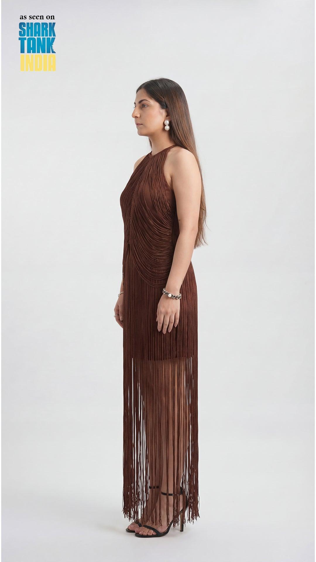 Woman wearing a brown fringe dress on a white background with Shark Tank branding.